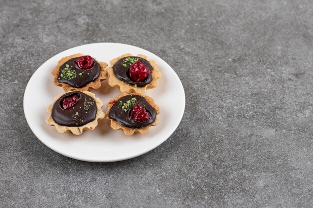 Top view of homemade chocolate cakes on white plate