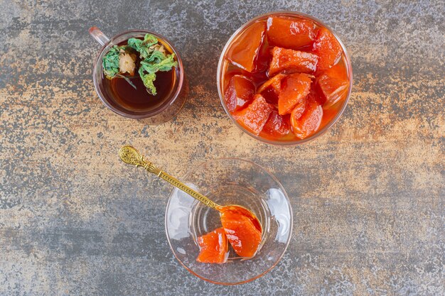 Top view of homemade jam with fragrant tea