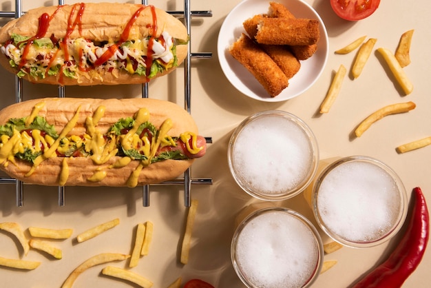 Top view of hot dogs with french fries and drink