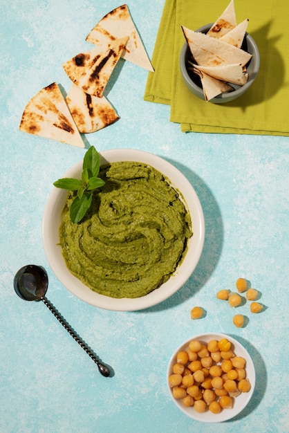 Free Photo top view hummus and chickpeas arrangement