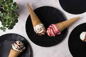 Free photo top view ice cream cones with different topping