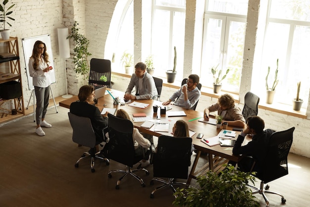 Top view image of motivated employees working together in the office Representing project Concept of business