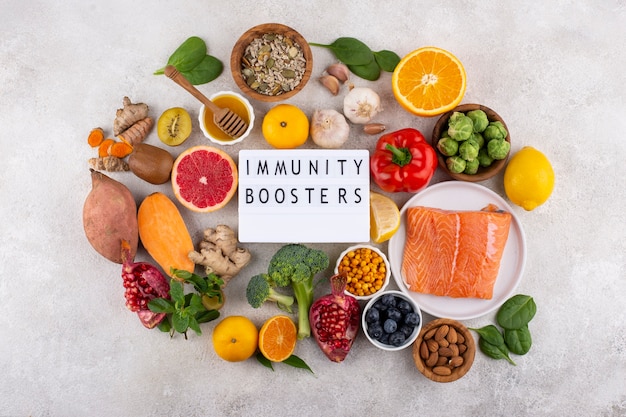 Free photo top view of immunity boosting foods with vegetables and fish