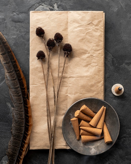 Top view incense aromatic cones and dried flowers