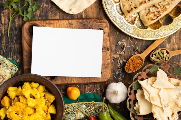 Free photo top view indian food with wooden board