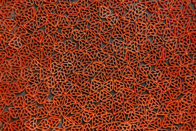 Free Photo top view italian pasta red hearts on dark table