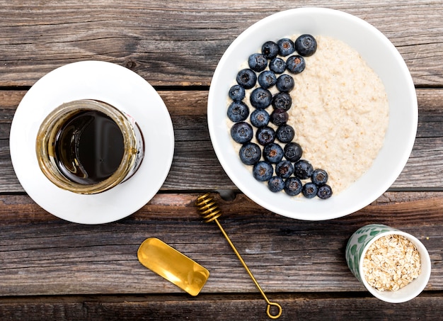 Free photo top view jam and blueberries on plate