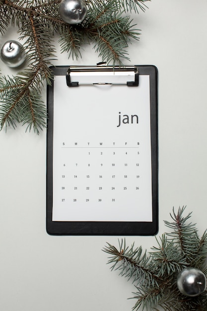 Free photo top view january calendar and globes