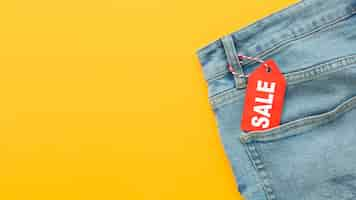 Free photo top view jeans with sale label copy space