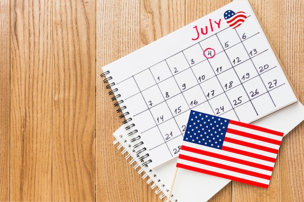 Free Photo top view of july month calendar with american flags and copy space