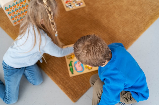 Free photo top view kids playing together