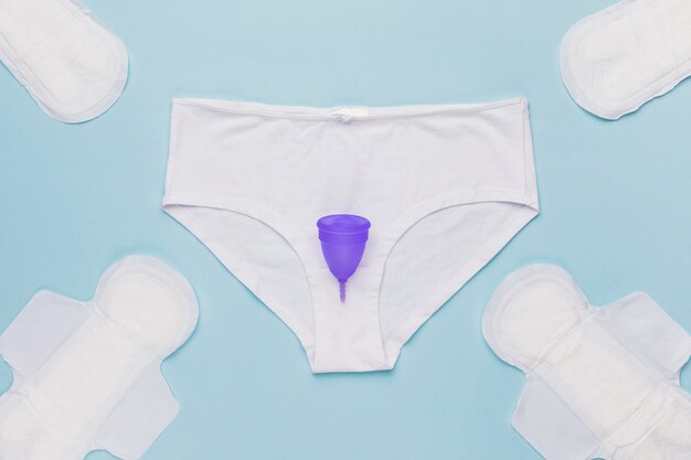 Top view knickers with menstrual cup and sanitary towels