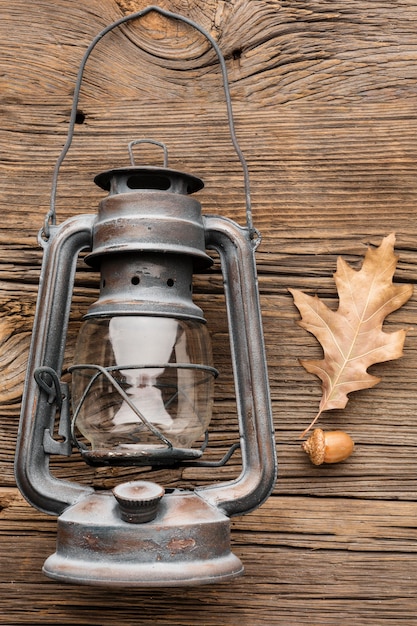 Free Photo top view of lantern with autumn leaves