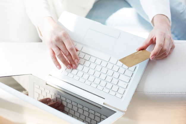 Top view of a laptop and a credit card