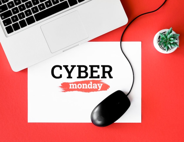 Free Photo top view of laptop and mouse with plant for cyber monday