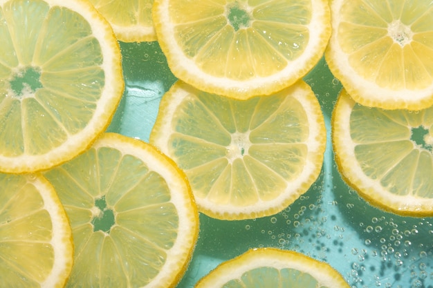 Top view lemon slices and sparkling water