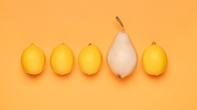 Top view lemons and pear arrangement