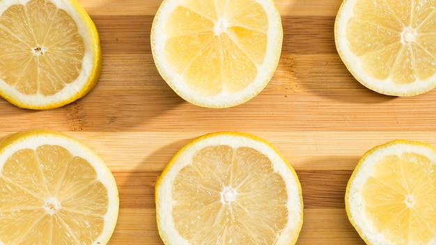 Top view lemons on wooden board