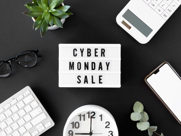 Free Photo top view of light box for cyber monday with clock and smartphone