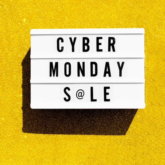 Free Photo top view of light box for cyber monday with golden glitter