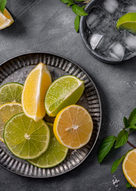 Top view lime and lemon slices on plate