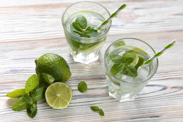 Top view lime lemonade glasses on table 