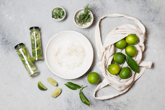 Top view limes and infused water bottles