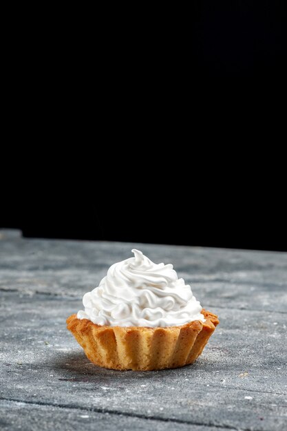 Top view little creamy cake baked delicious isolated on the grey table cake biscuit sweet photo cream