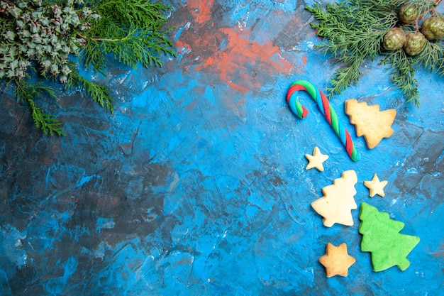 Top view of little tree figures on blue surface