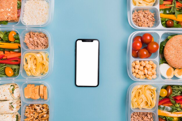 Top view lunchboxes with blank phone