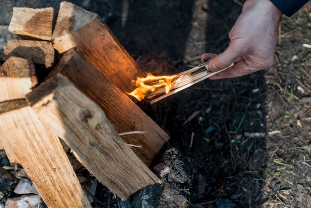 Top view man making bonfire