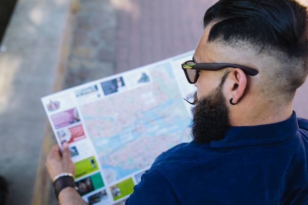 Free photo top view of man with a map