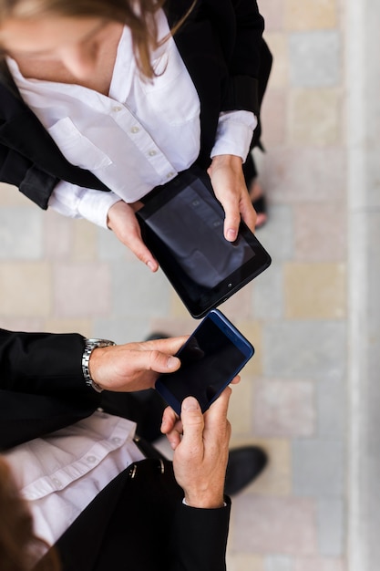 Free Photo top view man and woman with devices