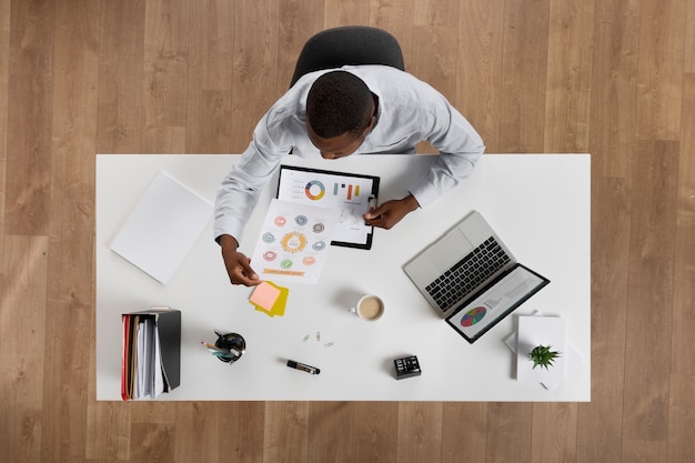 Top view man working at desk