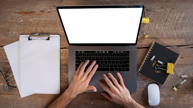 Top view man working on his laptop at home