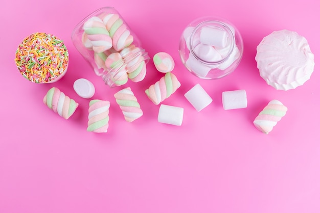 A top view marshmallows and meringues sweet and delicious on pink, cake biscuit sweet sugar