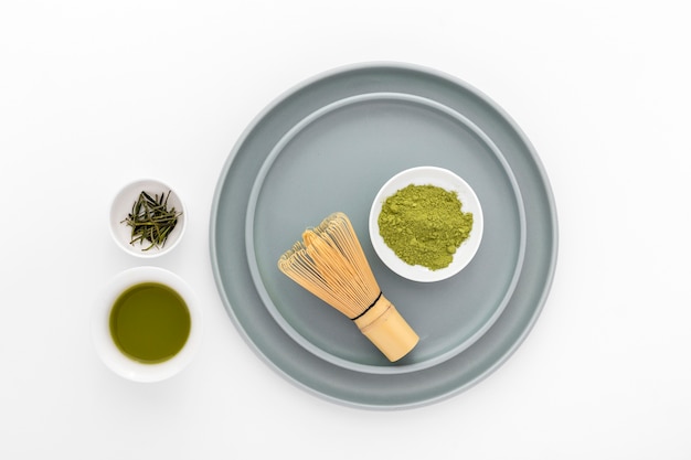 Top view matcha powder with bamboo whisk