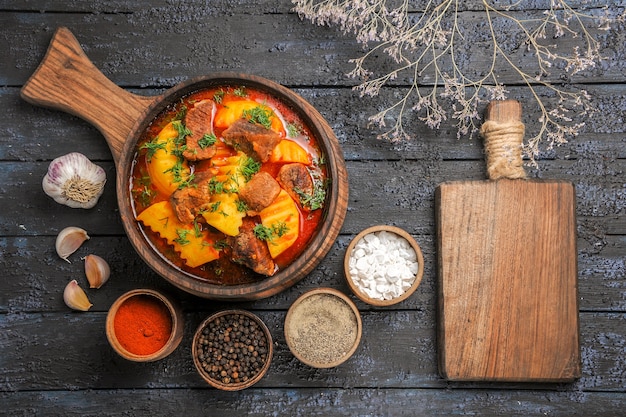 Free Photo top view meat sauce soup with greens and potatoes on a dark desk