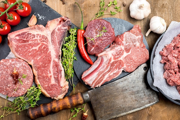 Top view of meat with garlic and herbs