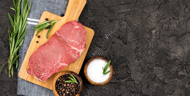 Top view of meat with spices and herbs