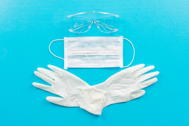 Top view medical gloves with mask and eyeglasses. horizontal