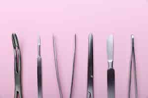 Free photo top view of medical scalpel with other instruments for medicine