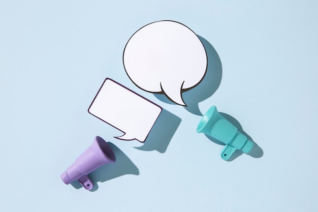 Top view megaphones and speech bubbles