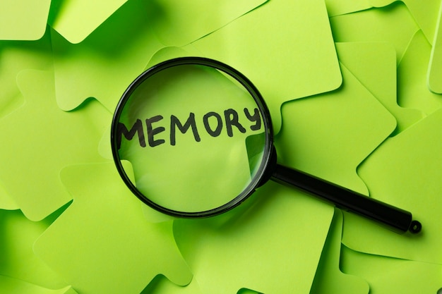 Free photo top view memory concept with post its and magnifying glass