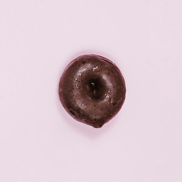 Top view mini glazed donut on pink background