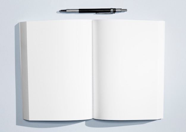 Free Photo top view minimalist notebook with pen