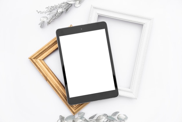 Free photo top view mock-up tablet with frames