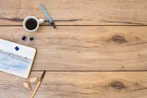 Free photo top view of modern artist desk with watercolor equipment