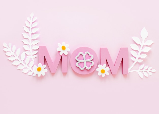 Free photo top view mom word on pink background