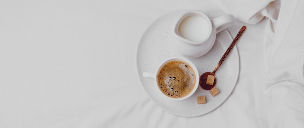 Top view of morning coffee with sugar cubes and copy space